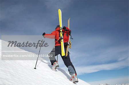 Winter mountaineering in wilderness area: male climber, exploring and adventure concept.