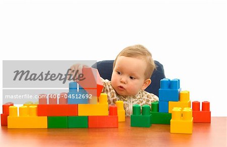 Cute baby girl with colorful blocks isolted background