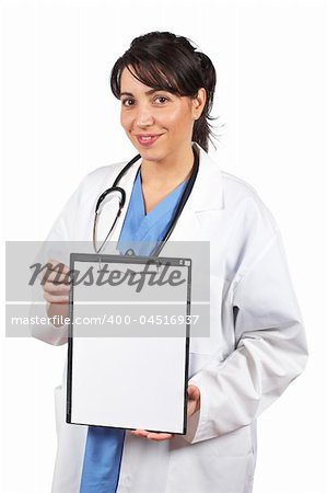 Friendly female doctor in lab coat showing a blank clipboard, over a white background.