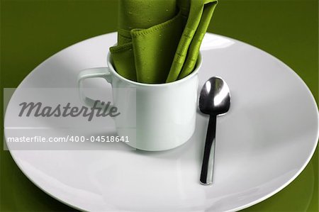 An elegant cafe table setting in green