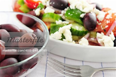 Black kalamata olives and greek salad with feta cheese