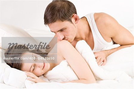 Young adult couple in the studio sleeping