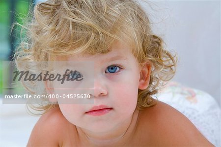 High key portrait of young blue eyed baby