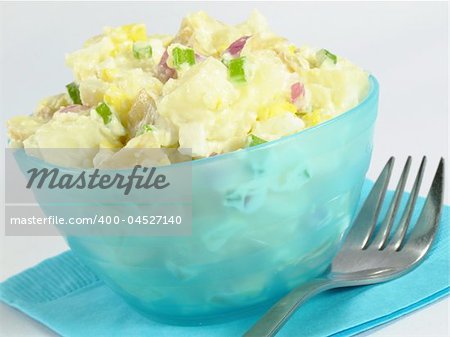 A delicious bowl of creamy potato salad.