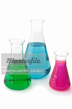 three lab flasks with blue green and magenta fluids