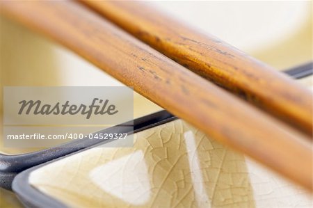 Abstract Chopsticks and Bowls with Narrow Depth of Field.
