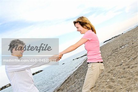 Mature romantic couple having fun on a beach