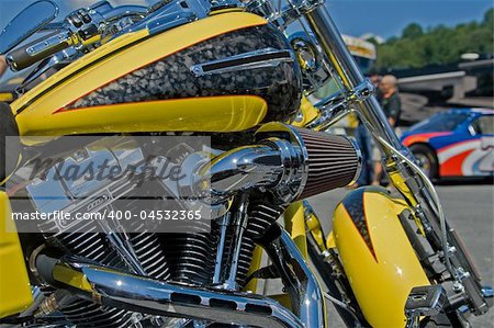 Yellow motorcycle along the road.