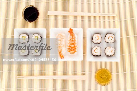 a plate with different kinds of sushi