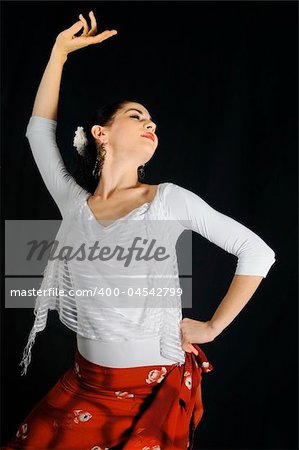 Portrait of young hispanic woman dancing flamenco