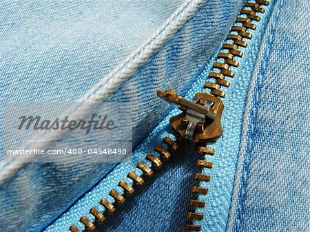 denim clothes fragment with zipper shallow DOF