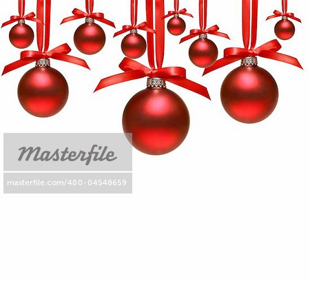 Red christmas balls with bows on white background