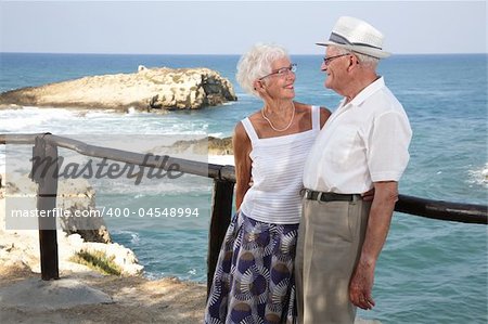 happy elderly couple looking in each other's eyes