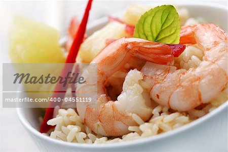 closeup of shrimps with pineapple,red pepper and rice, red curry,coconut and pineapple sauce