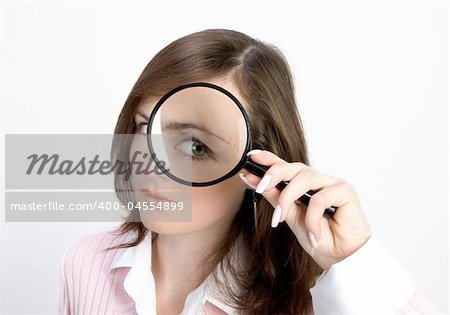Young Woman holding Magnifying Glass