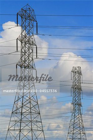 Top of the electricity pylons over cloudscape.