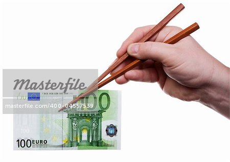 Hand holding the chopsticks with banknote. Isolated on white [with clipping path].
