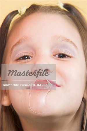 Young girl get gummed with bubble gum