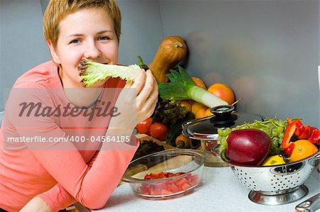 Young woman eating fresh salad. Healthy lifestyle concept