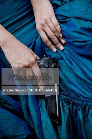 close up photo of female assassin wearing blue gown