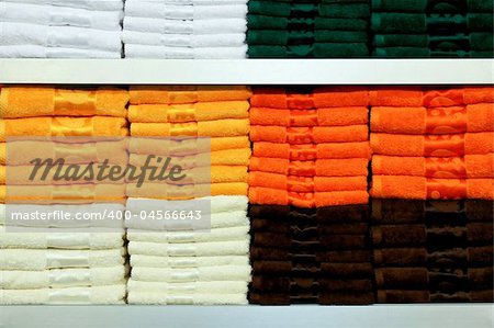 Big shelf with bunch of colorful towels