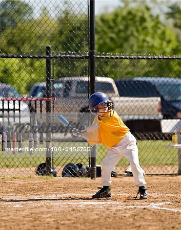 Cute Little Boy Up to Bat at Baseball Game