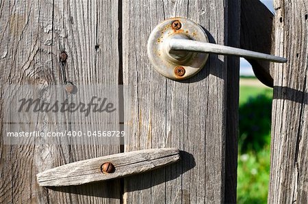 Old Wooden Door With Rusty Lock