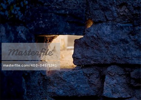 Light coming out of a hole in a old grunge house