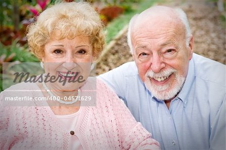 Portrait of a beautiful, happy senior couple outdoors in the garden.