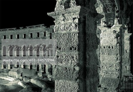 Night photo of the ancient Roman amphitheater in Pula , Croatia