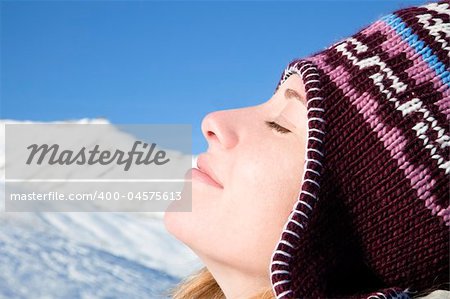 side view of young woman enjoying mountain