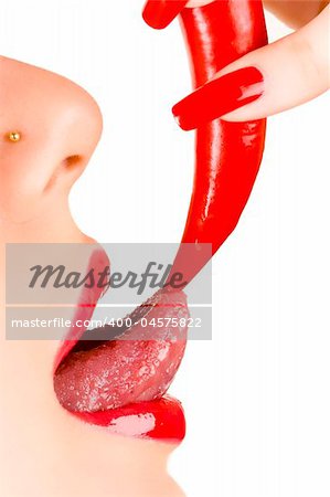 girl with piercing in her nose with chili