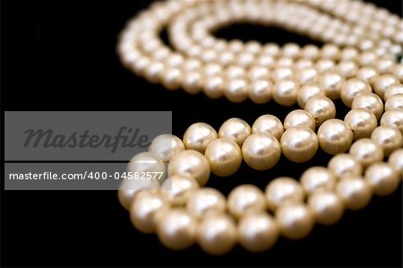 Pearl necklace isolated on black