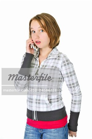 Teenage girl talking on a cell phone acting surprised isolated on white background