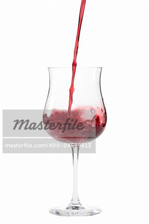 red wine splashing in a glass