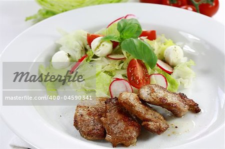 Pork steak with vegetable salad