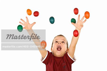 Happy boy shouting and reaching out for the falling colorful easter eggs - isolated, without motion blur