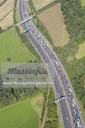 Helicopter aerial shot of traffic congestion on the M25 motorway around London, England