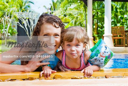 Portrait of beautiful young woman with her daughter