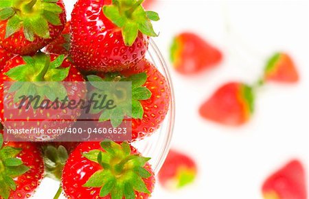 Close up view of fruit dish filled with nice red strawberries