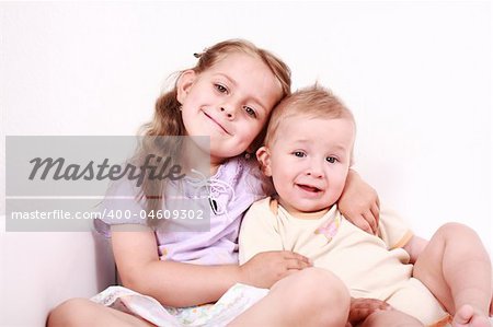 Cute little girl with her small brother together