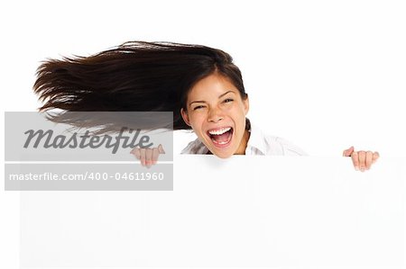 Very excited woman holding billboard / blank sign. Isolated on white.