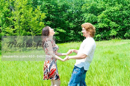 A lovely laughing couple having fun outside