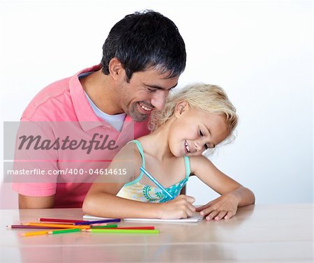 Man and little girl painting together at home