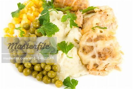 Close-up of meatballs, potatoes, verdure, peas and corn dish