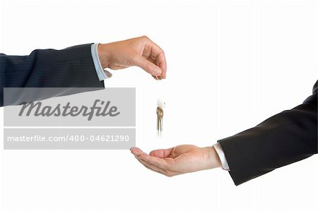 One male hand let the keys fallen into another hand of musinessman with visible motion blur