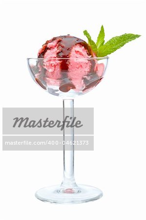 Delicious raspberries ice cream with syrup in glass. Shallow depth of field
