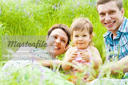 A family having rest in the meadow