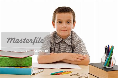 Happy schoolboy staying calm - isolated