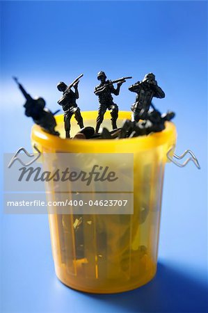 Toy soldiers row on the trash, end of war metaphor, peace